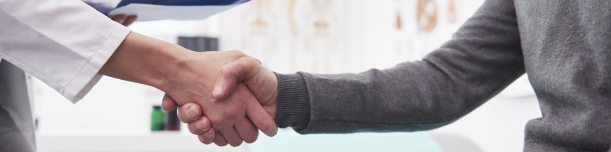 Detail of handshake of doctor and patient. Detail of handshake of doctor and patient.